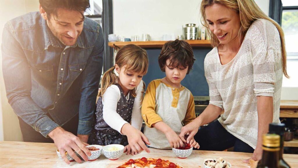 Family enjoying cooking together in a kitchen